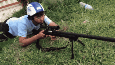 Man In Helmet With Number 2 Holding Rifle GIF