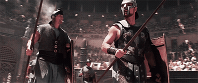 Man In Helmet With Spear And Shield Before Crowd GIF