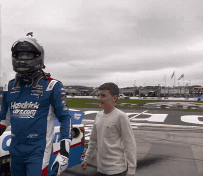 Man In Hendrick Cars.com Uniform Walking With Boy GIF