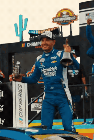 Man In Hendrick's Car Holding Bell GIF