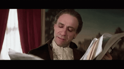 Man In Historical Costume Holding Papers GIF