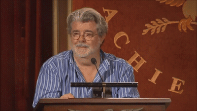 Man In Historical Costume Sitting In Office Chair GIF