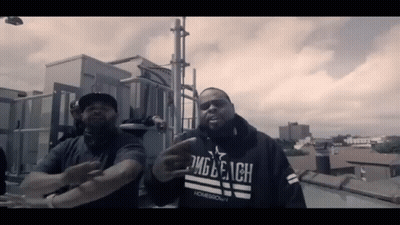 Man In Homegrown Hoodie Standing Next To Another Man GIF