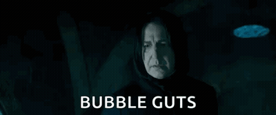 Man In Hood Holding Glass Ball Says Bubble Guts GIF