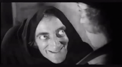 Man In Hood Smiling Black And White GIF