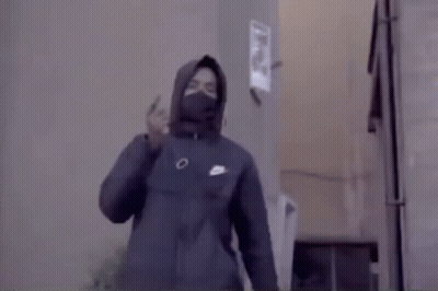 Man In Hooded Jacket And Mask Standing In Room GIF