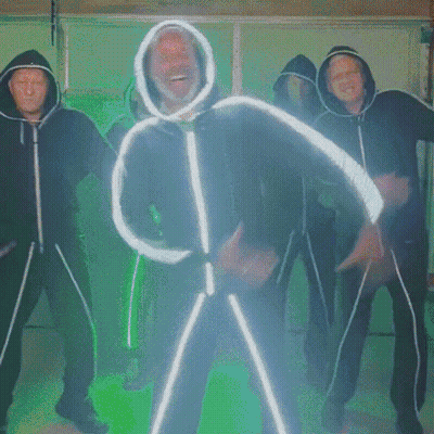 Man In Hooded Jacket Dancing With Group GIF