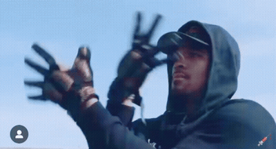 Man In Hooded Jacket Giving Peace Sign GIF