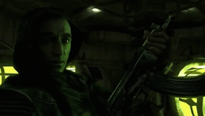 Man In Hooded Jacket Holding Gun GIF