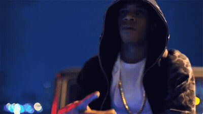 Man In Hooded Jacket Holding Gun GIF
