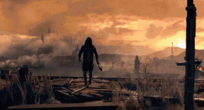 Man In Hooded Jacket Holding Sword In Field GIF