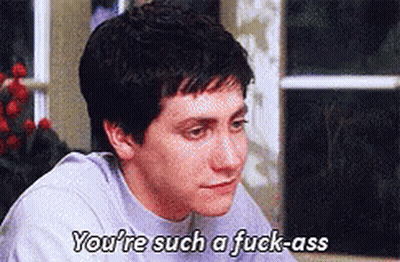 Man In Hooded Jacket Looking At Camera GIF