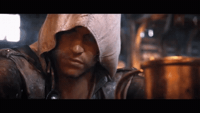 Man In Hooded Jacket Looking At Camera GIF