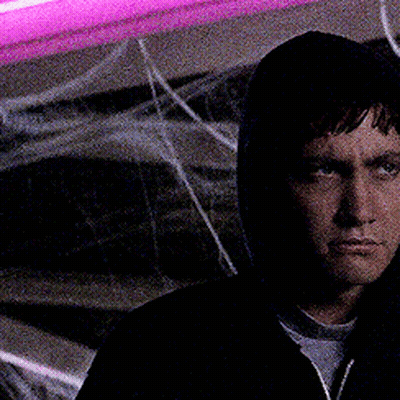 Man In Hooded Jacket Looking At Camera GIF