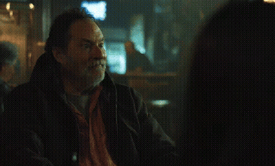 Man In Hooded Jacket Looking Out Window GIF
