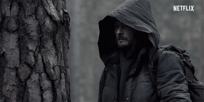 Man In Hooded Jacket Next To Tree With Netflix GIF
