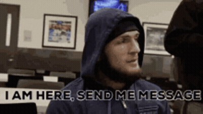 Man In Hooded Jacket Saying I Am Here Send Me Message GIF