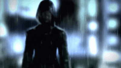Man In Hooded Jacket Standing In Rain Blurry Photo GIF