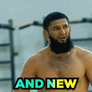 Man In Hooded Jacket Walking Into UFC Room GIF