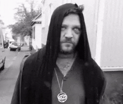 Man In Hooded Jacket With Celtic Necklace GIF