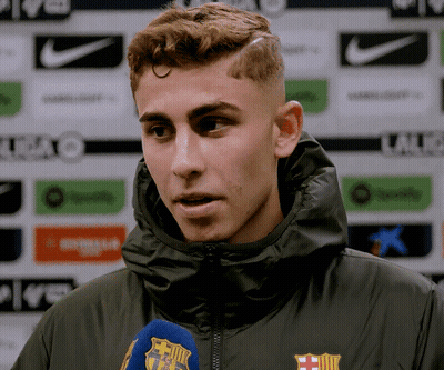 Man in Hooded Jacket With FCB Logo