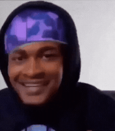 Man In Hoodie And Hat Smiling GIF