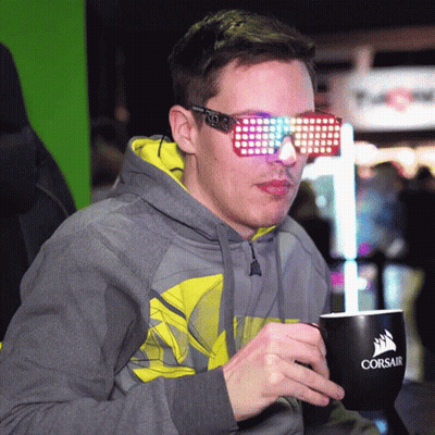 Man In Hoodie And Sunglasses Holding Corsair Mug GIF