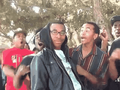 Man In Hoodie Facing Group GIF