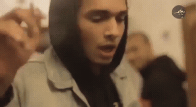 Man In Hoodie Holding Microphone GIF