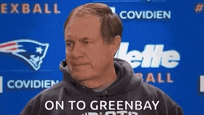 Man In Hoodie In Front Of Green Bay Packers Logo GIF