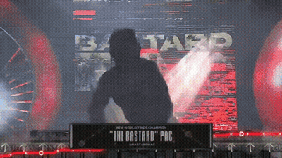 Man In Hoodie In Front Of The Bastard Pac Sign GIF
