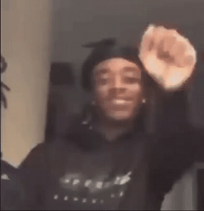 Man In Hoodie Making Fist GIF