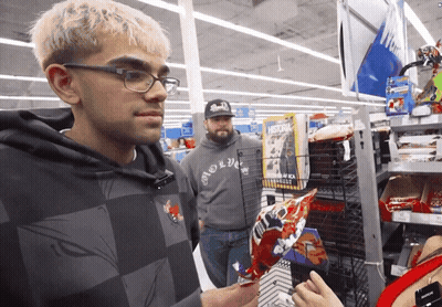 Man In Hoodie Saying Brooklyn Looking At Something GIF