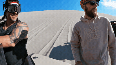 Man In Hoodie Saying Dawn To Waste Next To Another Man GIF