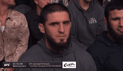 Man In Hoodie Saying The Toys Sits In Crowd GIF
