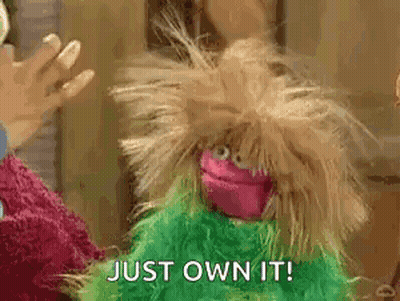 Man In Hoodie Saying We Are Trainin In Front Of Painting GIF