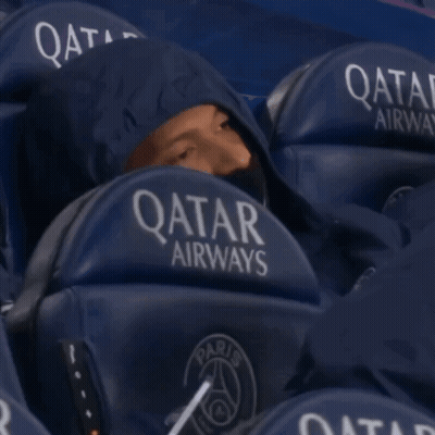 Man In Hoodie Sitting In Qatar Airways Stadium Seat GIF