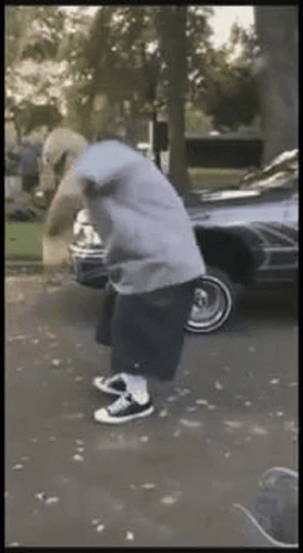 Man In Hoodie Standing In Driveway GIF