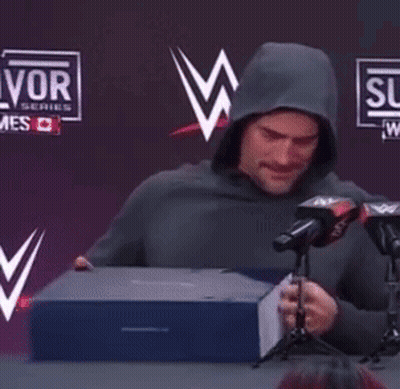 Man In Hoodie Thumbs Up At Microphones GIF