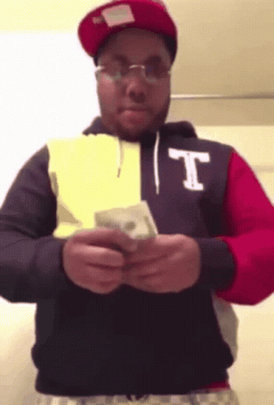 Man In Hoodie With Letter T Holding Money GIF