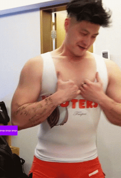 Man In Hooters Tank Top And Shorts GIF