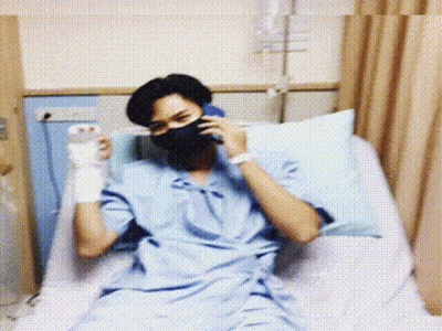 Man In Hospital Bed On Phone GIF