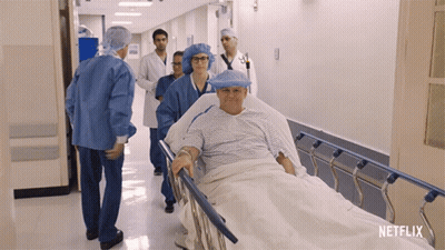 Man In Hospital Bed Pushed By Netflix Ad GIF