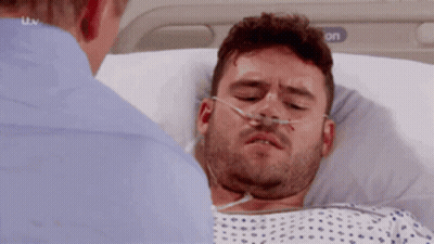 Man In Hospital Bed With Oxygen Mask GIF