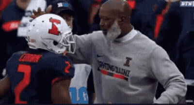 Man In I Sweatshirt Talking To Football Player GIF