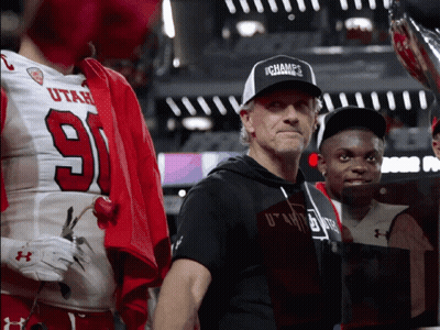 Man In Ichamps Hat Next To Football Player GIF