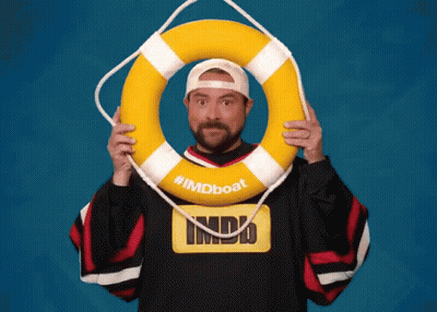 Man In Imdb Shirt Holding Life Preserver GIF