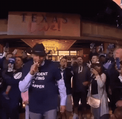 Man In Incident Waiting To Happen Shirt In Front Of Crowd GIF