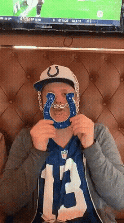 Man In Indianapolis Colts Jersey Holding Blue Horseshoe GIF