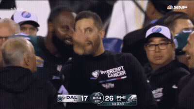 Man In Intercept Cancer Shirt In Crowd GIF
